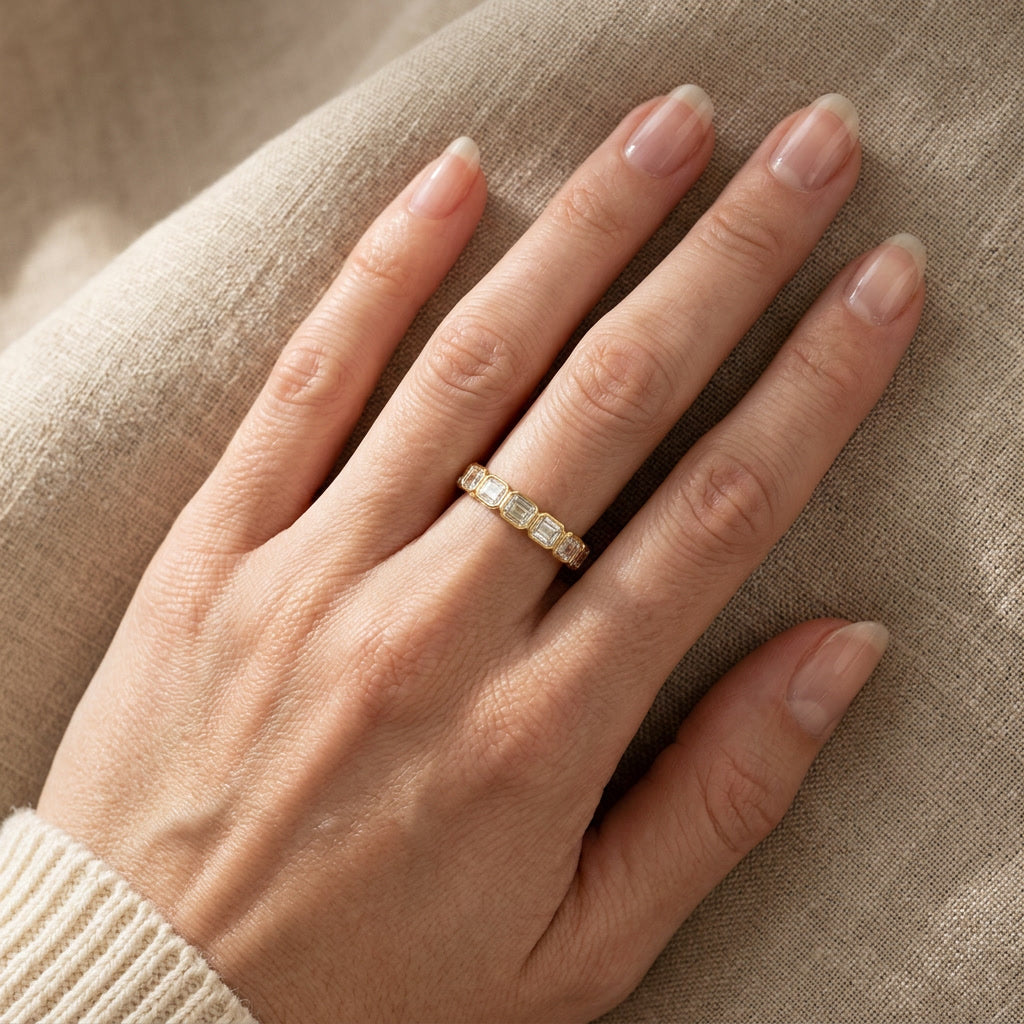 LUMINA HORIZON emerald-cut moissanite band on hand | Heritage & Co.