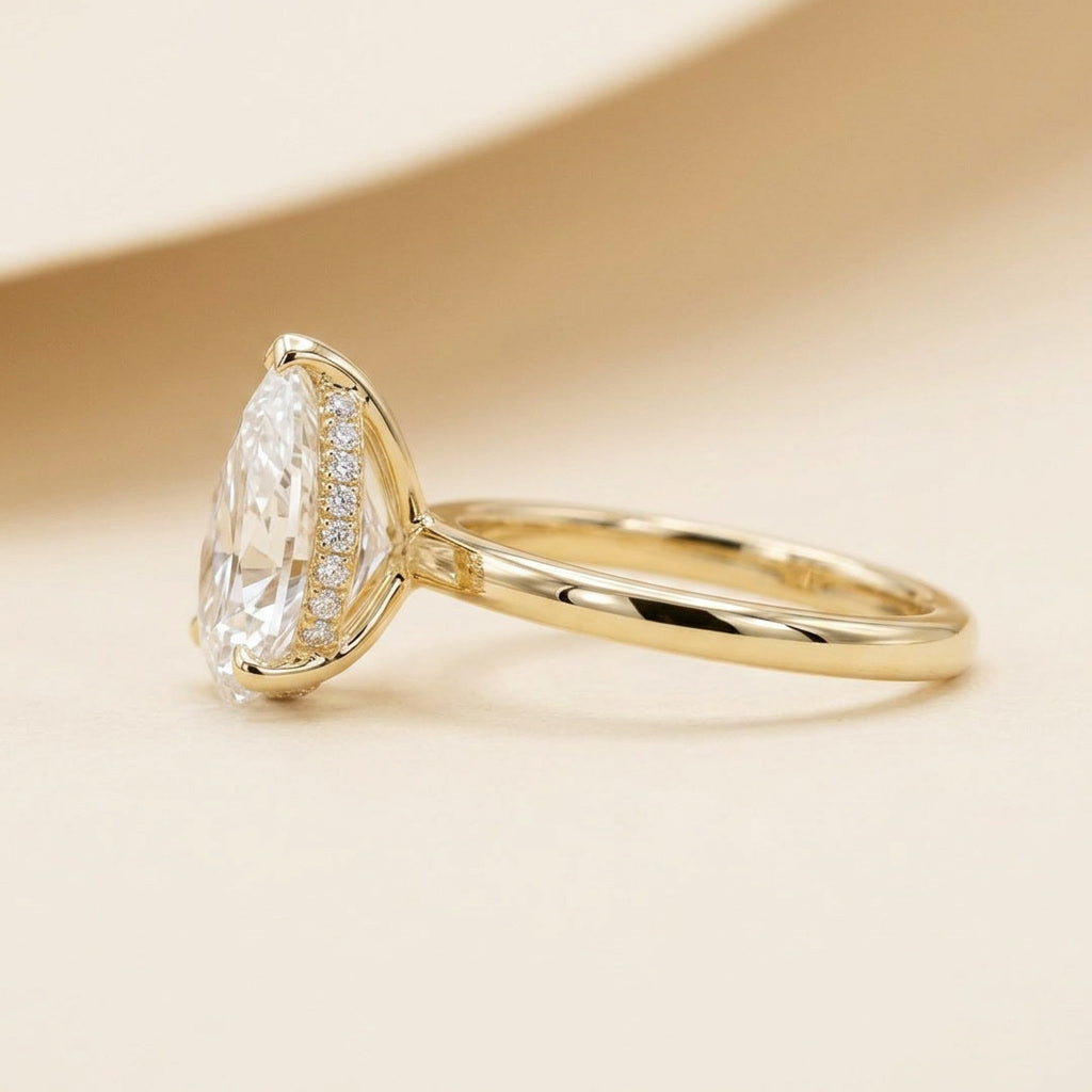 AETERNA ROSÉE pear moissanite ring — side profile showing hidden halo