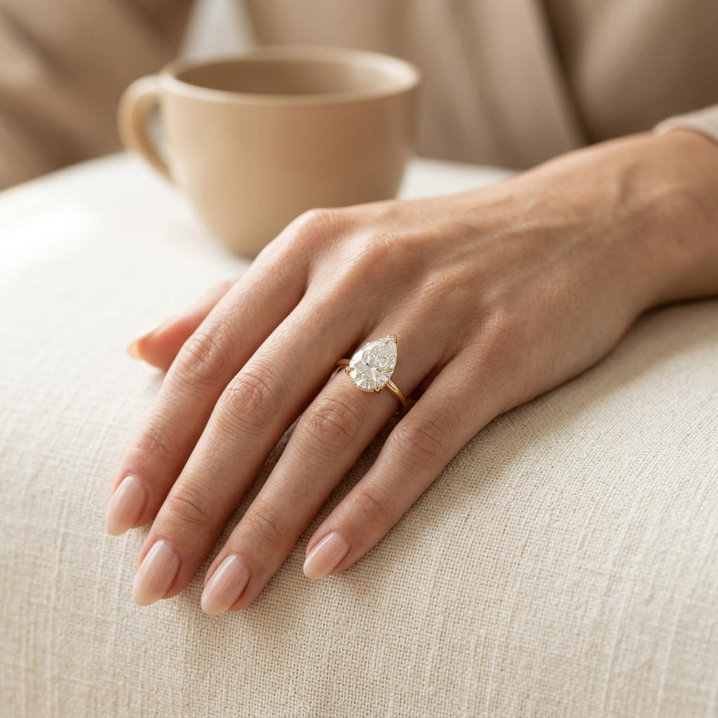AETERNA ROSÉE pear moissanite ring — lifestyle detail
