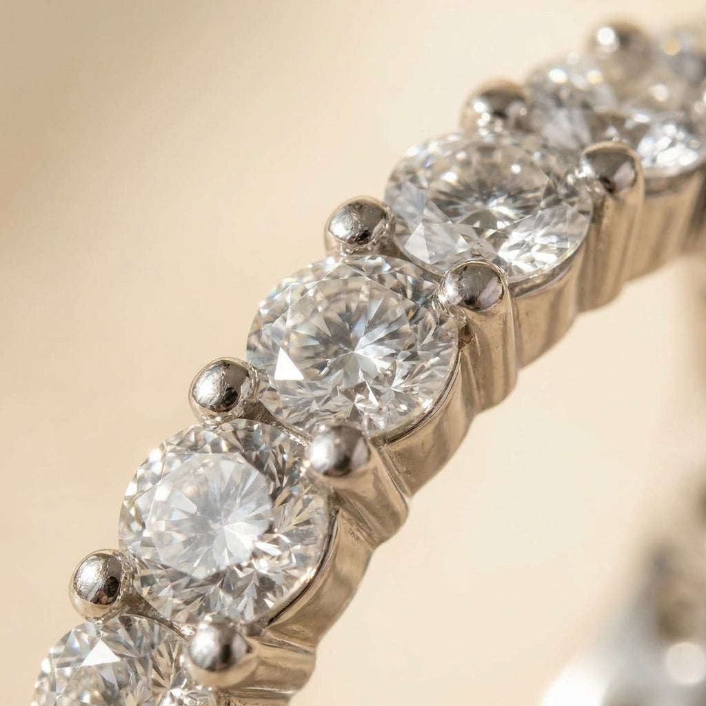 Macro detail of round brilliant lab diamonds in fishtail shared-prong setting