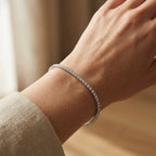 Tennis bracelet fitted on the wrist showing the fine 2mm proportions