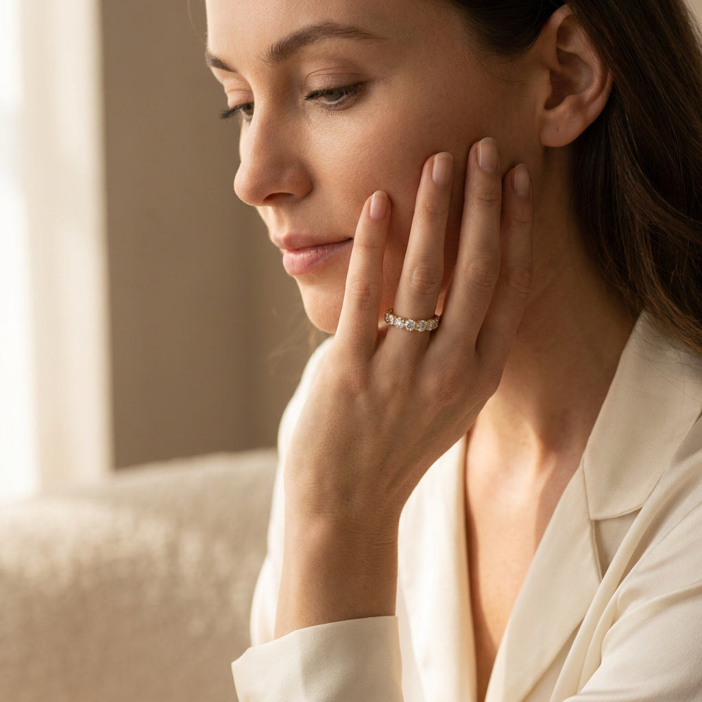 LUMINA GRANDEUR round moissanite eternity band — worn, face in frame