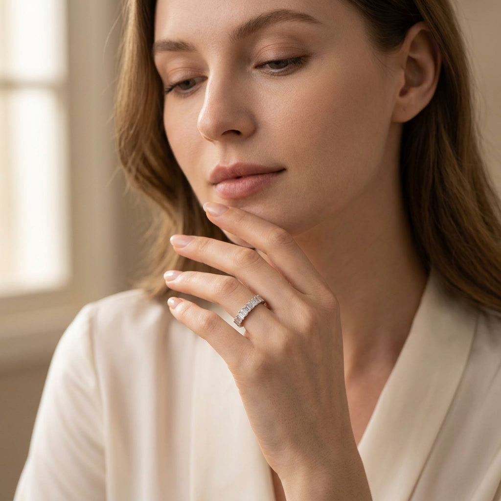 LUMINA MAJEUR baguette moissanite eternity band — worn, face in frame