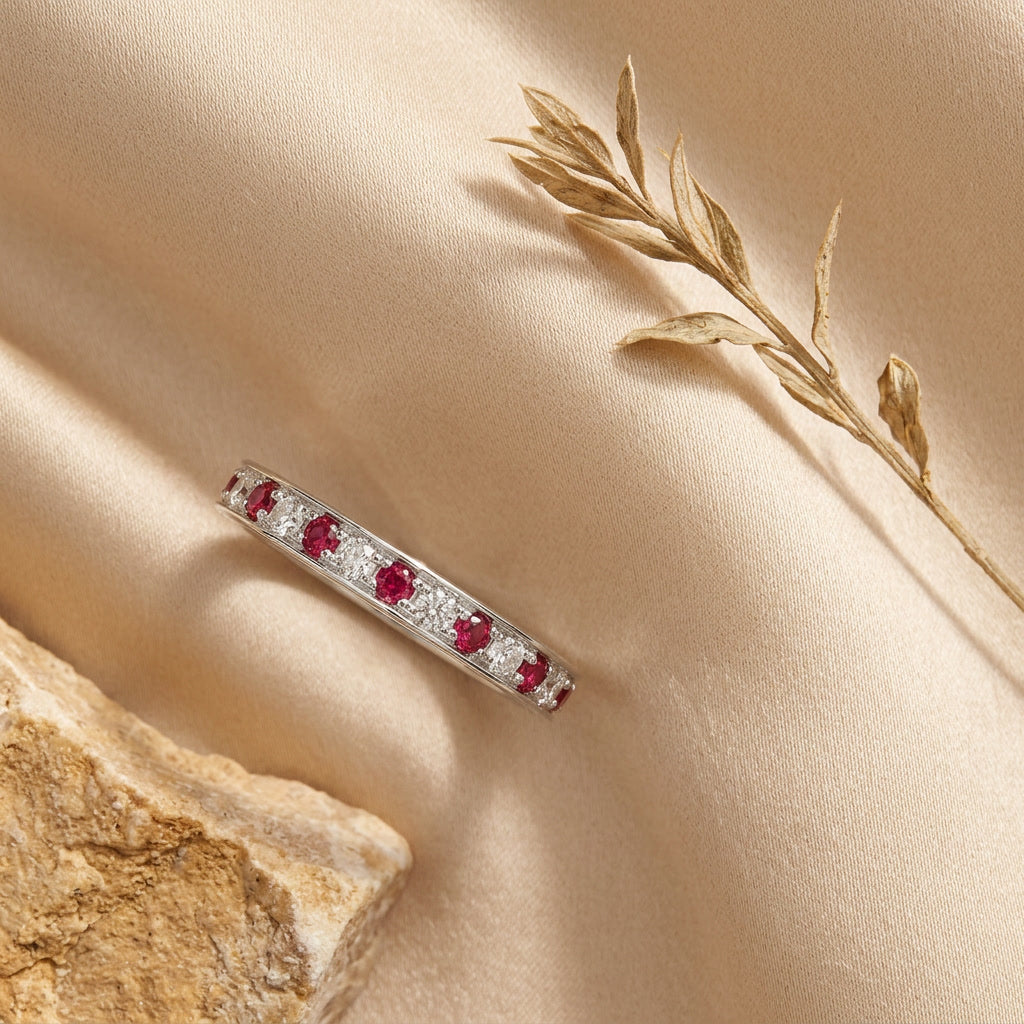 LUMINA RUBIS ÉTERNITÉ ruby and diamond eternity band — editorial flat lay